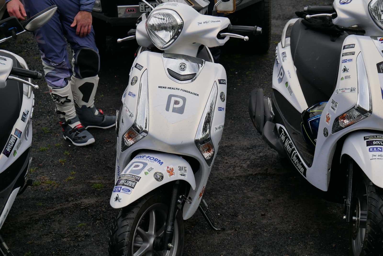 Fundraiser scooters parked together outdoors